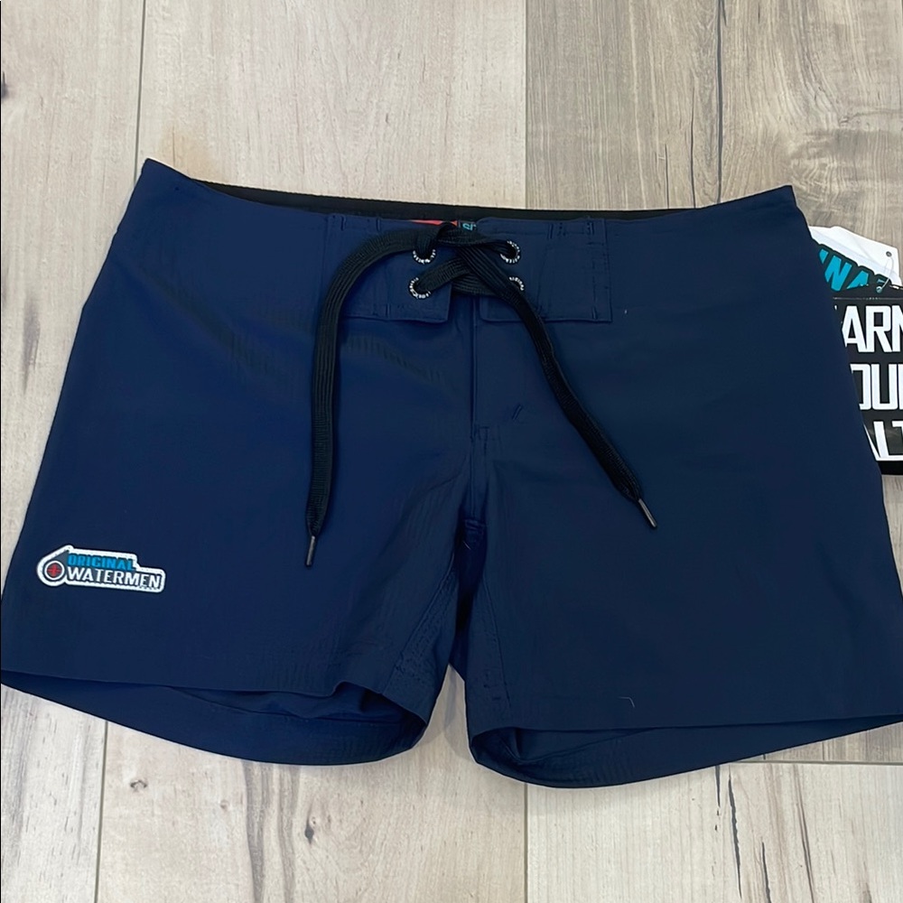 NWT Girls Original Waterman Board Shorts, size small.